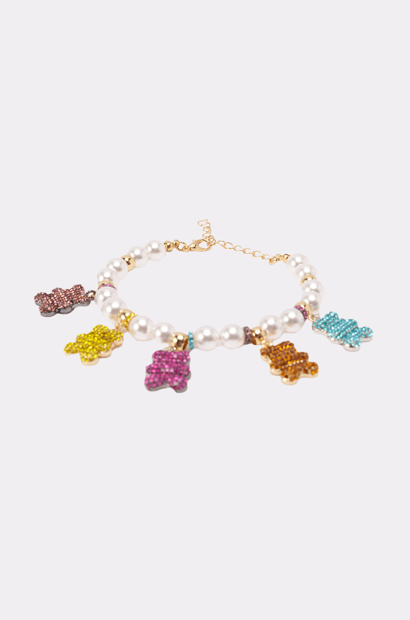 The LUXE BEAR CHARM BRACELET, featuring white faux pearl beads and five colorful bear charms in pink, yellow, purple, orange, and blue, is shown on a plain white background. 2