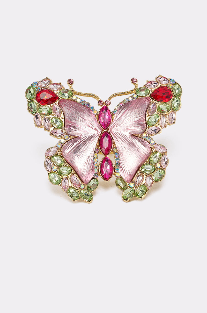 Pair the SPREAD YOUR WINGS RING, adorned with jeweled pink butterfly wings and green, red, and pink gemstones, with a statement ring for a vibrant, bold look. 2