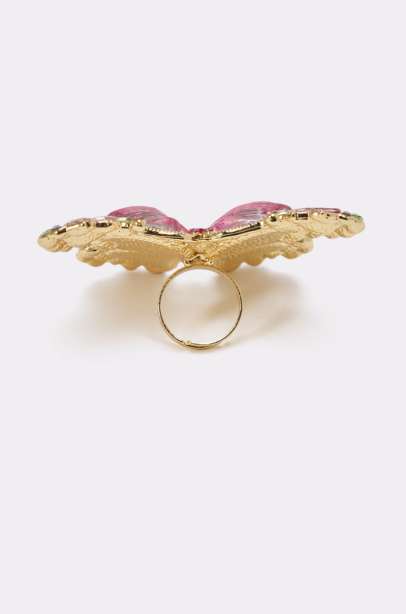 The SPREAD YOUR WINGS RING features gold and pink butterfly designs with jeweled accents, shown from the side to highlight the band and intricate wing details against a plain light background. 5