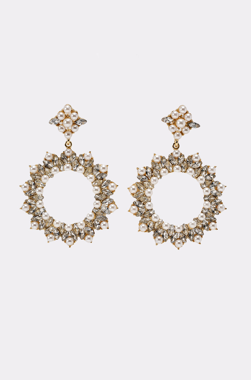 The PEARL PLS EARRING features gold-tone circular rhinestone detailing, white stones, and faux pearls with a diamond-shaped stud atop. Set against a light-colored plain background. 2