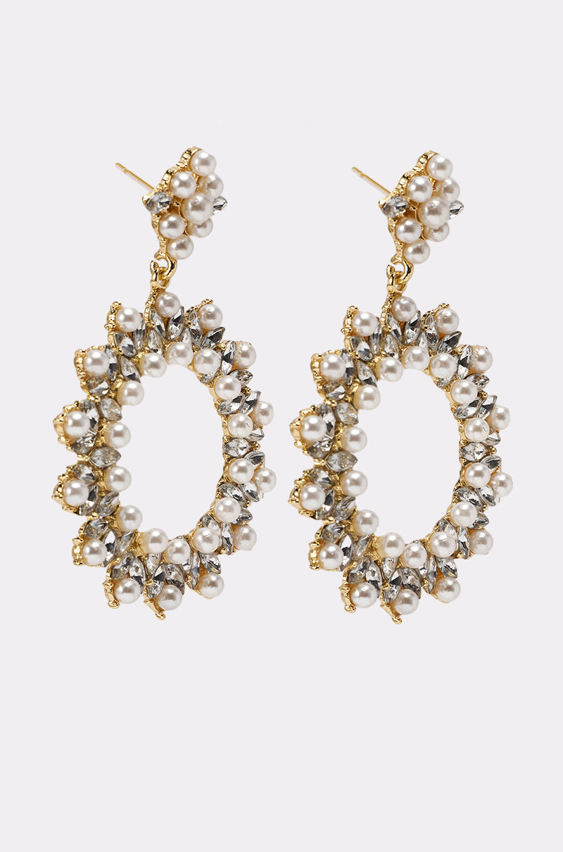 The PEARL PLS EARRING features gold statement oval hoops adorned with clustered faux pearls and small metallic beads, creating a textured, intricate look against a plain white background. 4