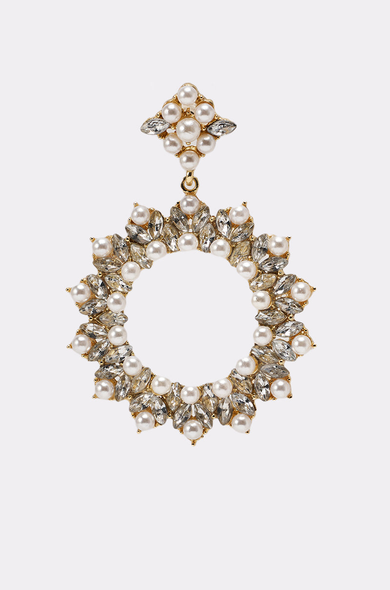 The PEARL PLS EARRING is a gold, circular hoop earring decorated with white pearls and clear gemstones, finished with rhinestone trim and a matching diamond-shaped stud at the top. 5