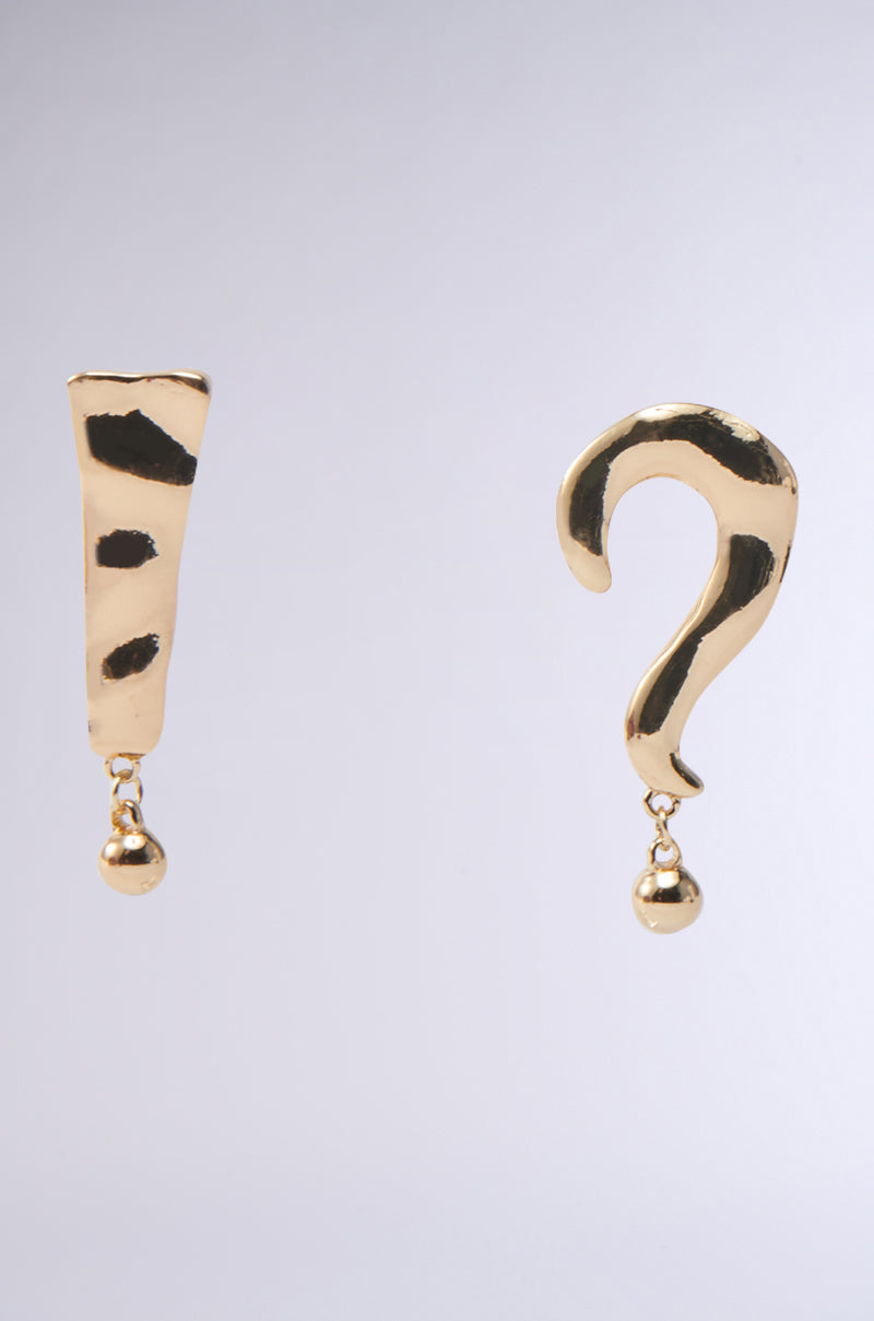 Introducing the EXCUSE ME EARRING: gold-tone exclamation and question mark earrings with a hammered-metal finish and dangling spheres, set against a plain gray background. 0