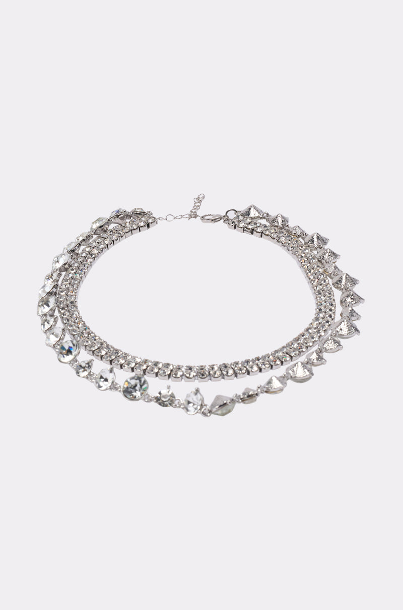 The LOVER NECKLACE is a silver-tone rhinestone necklace with three rows of sparkling clear gemstones arranged in ornate patterns, shown against a plain white background.