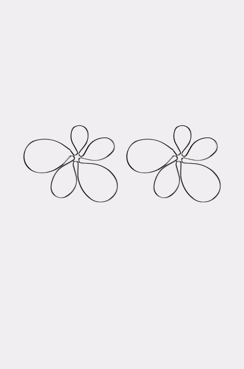 The LOVEY EARRING features two abstract, flower-like shapes with smooth, overlapping black loops, arranged side by side on a plain light background. 1