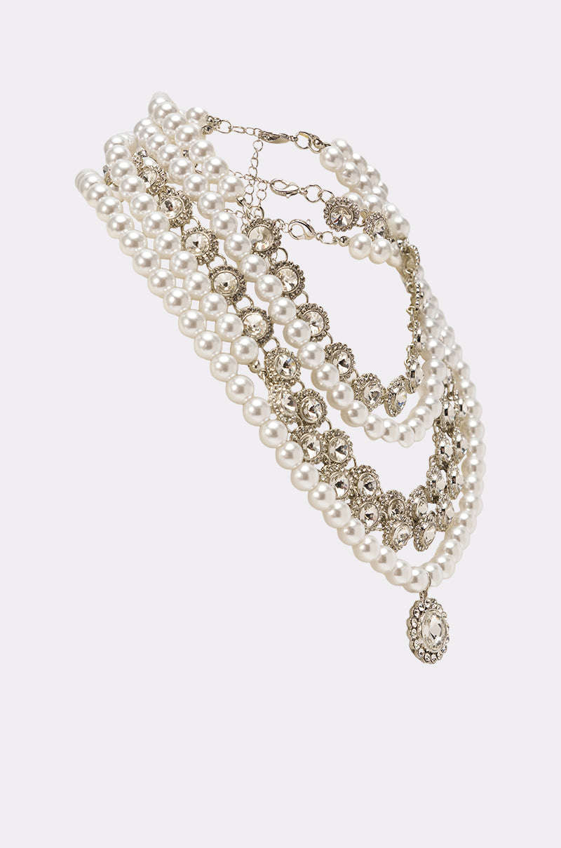 The AFFORD IT NECKLACE showcases faux pearls, silver-toned chains, and a vintage-inspired cameo pendant with ornate metalwork, creating a stunning statement piece of jewelry. 2