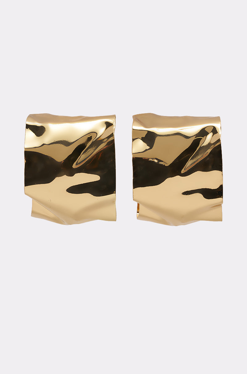 The BENT OUTTA SHAPE EARRING features two shiny gold sculptural earrings with a crumpled, textured surface displayed against a plain light background. 0
