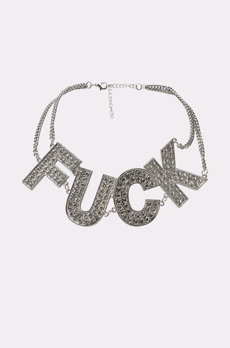 The ME NECKLACE is a bold rhinestone statement piece featuring large crystal letters on a silver chain—edgy and perfect for layering with your favorite styles. 0