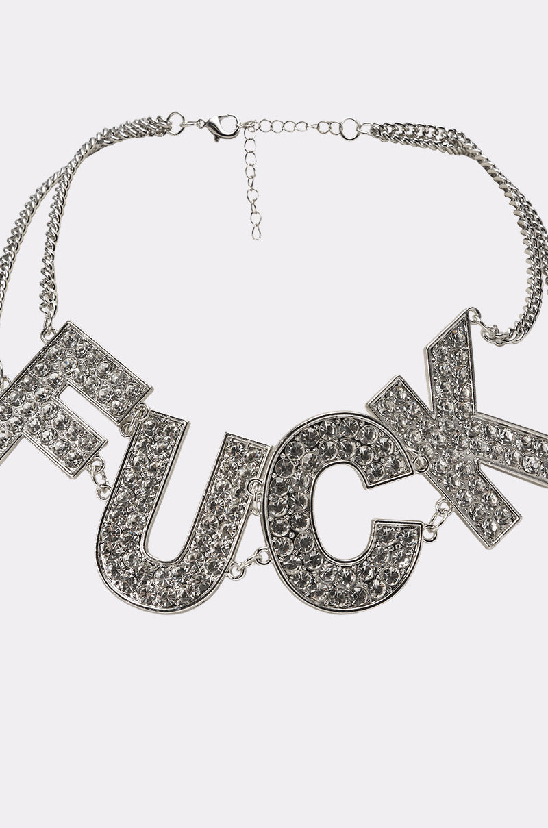 Make a statement with the ME NECKLACE—a bold silver chain featuring large crystal letter charms spelling out "ME" in uppercase. This standout rhinestone necklace is perfect festival jewelry for anyone who loves attention. 3