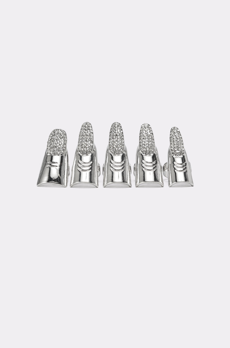Five STELLA RING SET silver, rhinestone pavé-encrusted artificial fingernail tips are arranged side by side on a plain white background. 3