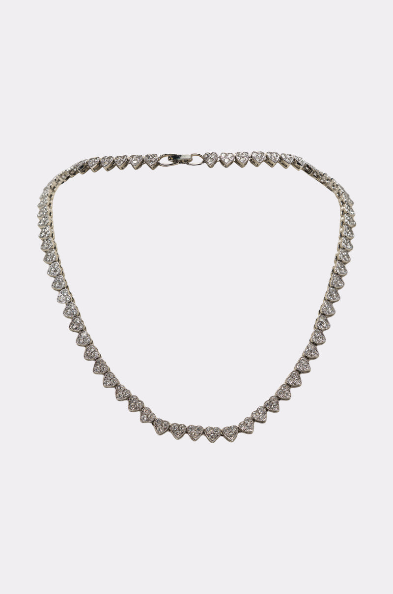 The REALLY LIKE THAT LUXE NECKLACE is a delicate, heart-shaped rhinestone piece with sparkling gemstones on a thin silver-tone chain, presented on a plain white background. 0
