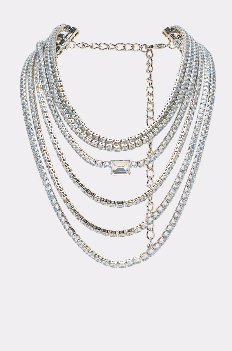 The KYLIE NECKLACE is a stunning layered statement piece with sparkling crystal rhinestones, a large rectangular central gem, and an adjustable chain clasp—perfect elegant jewelry for special occasions.