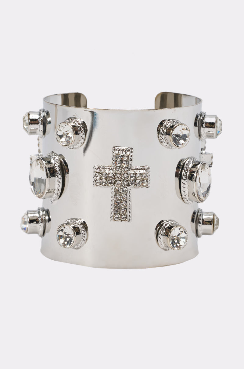 The TRU CUFF BRACELET is a wide, shiny silver cuff featuring large round clear gemstones and a central cross with smaller crystals—an eye-catching rhinestone bracelet, ideal for concerts.