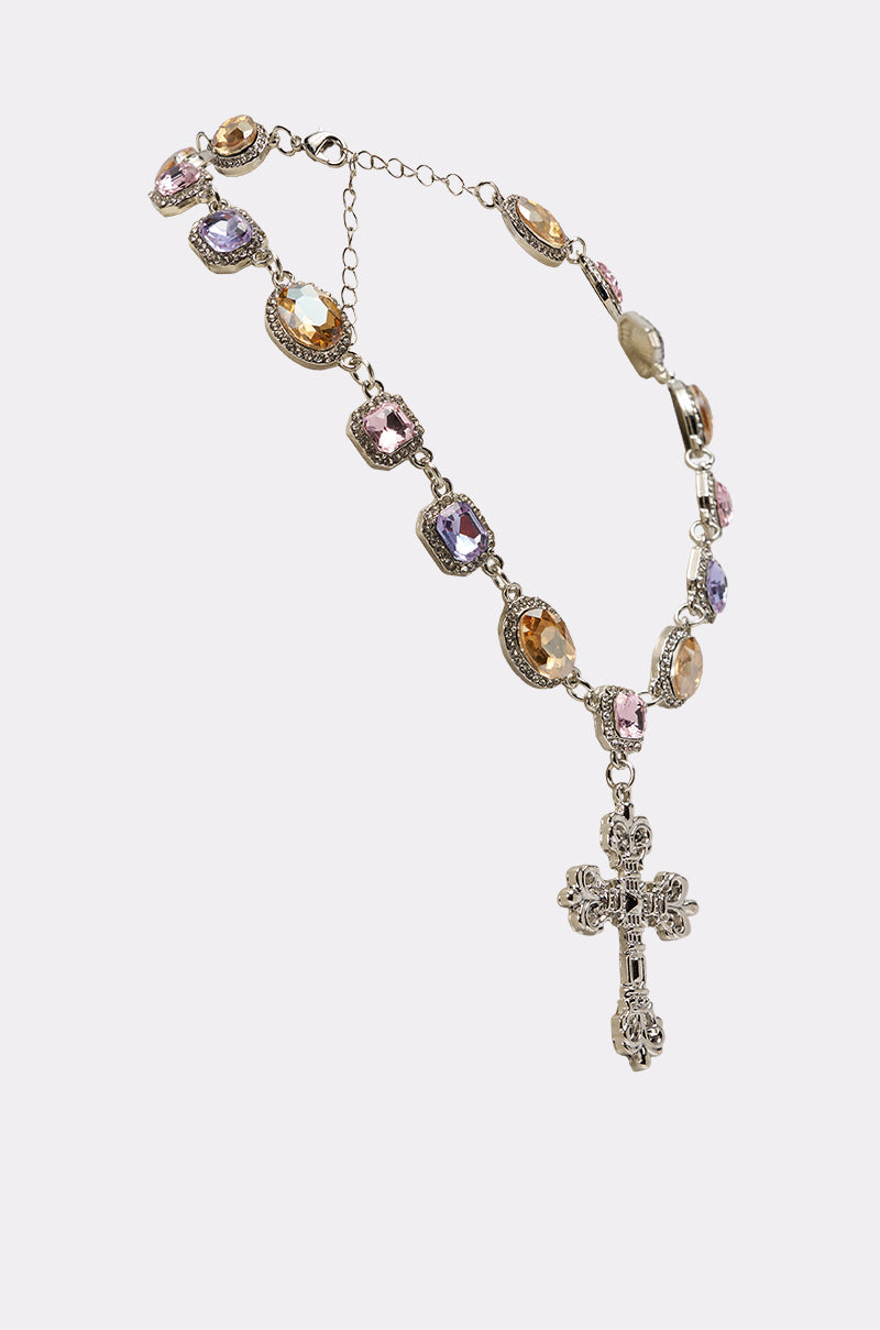 The MY LEGACY NECKLACE features decorative silver, ornate pastel jeweled beads, and an intricate crystal cross pendant, displayed against a plain light background. 2