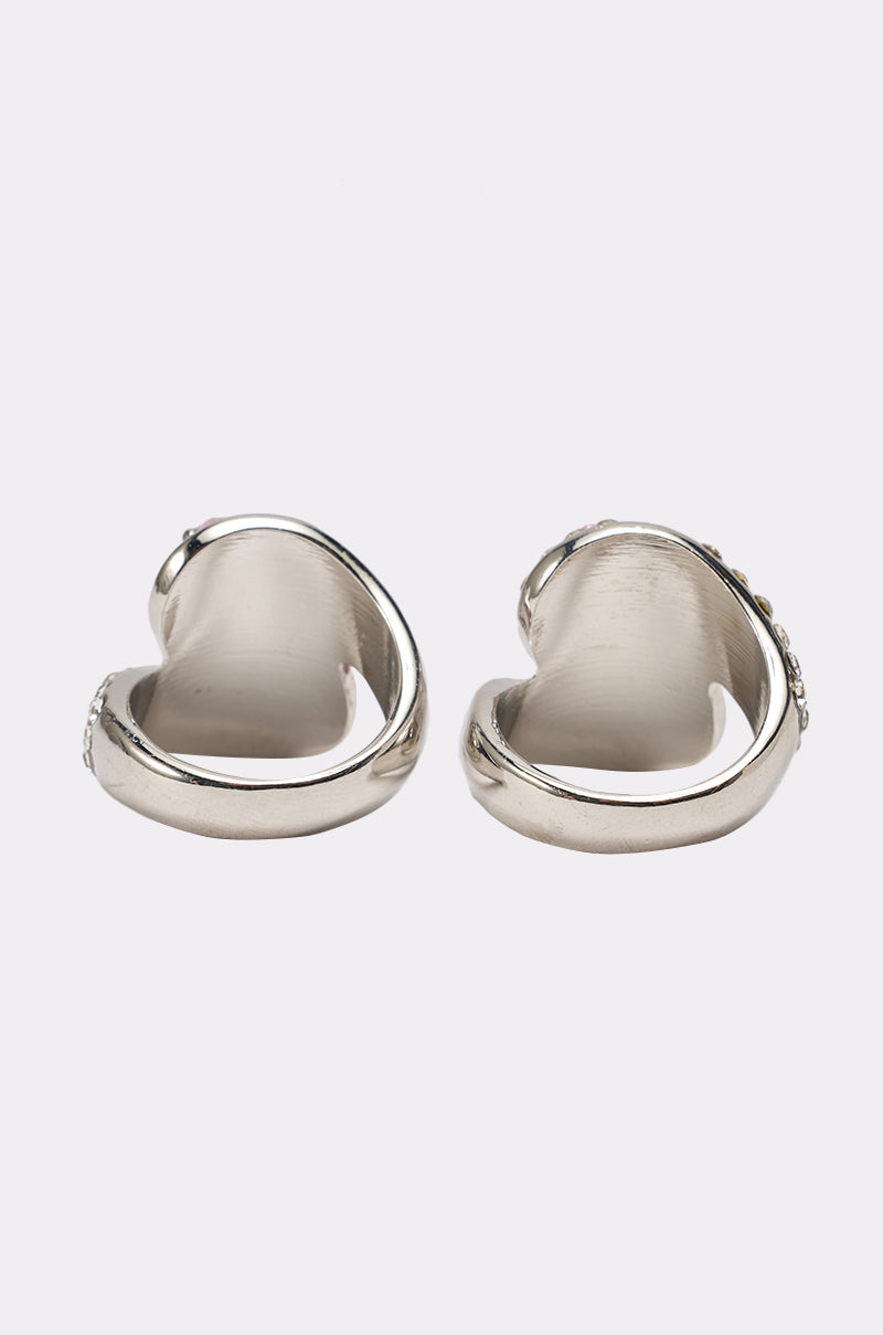 The PRETTY IN PINK RING SET features two chunky silver rings with a smooth, shiny finish, displayed upright on a plain white background to highlight their rounded, modern design. 3