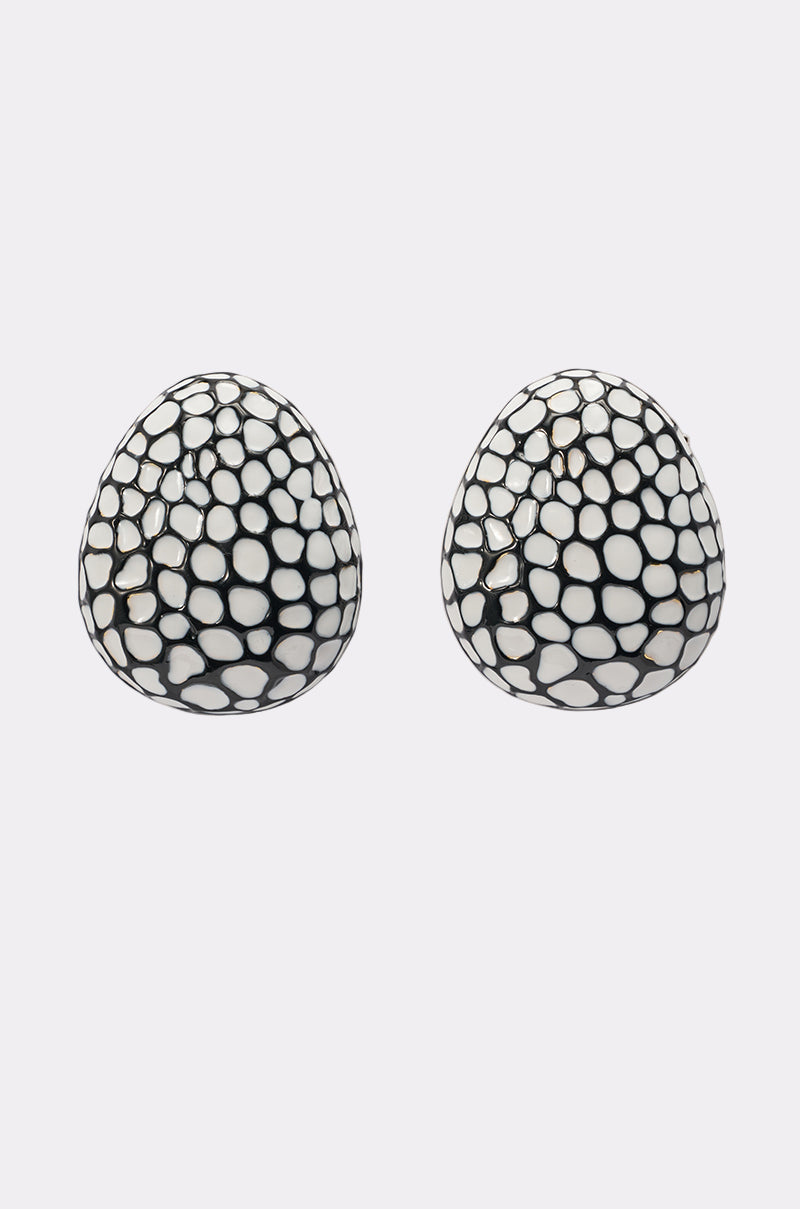 The CANT LOSE EARRING is a pair of oval-shaped statement studs featuring a black and white polka dot pebble pattern, shown against a plain white background. 0