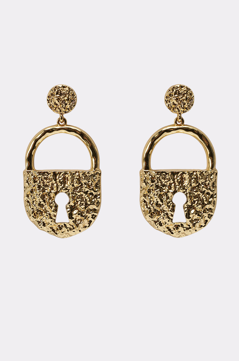 The ON LOCK EARRING features a gold-tone drop design with chunky, hammered padlock shapes, keyhole cutouts, and round textured studs at the top. 0