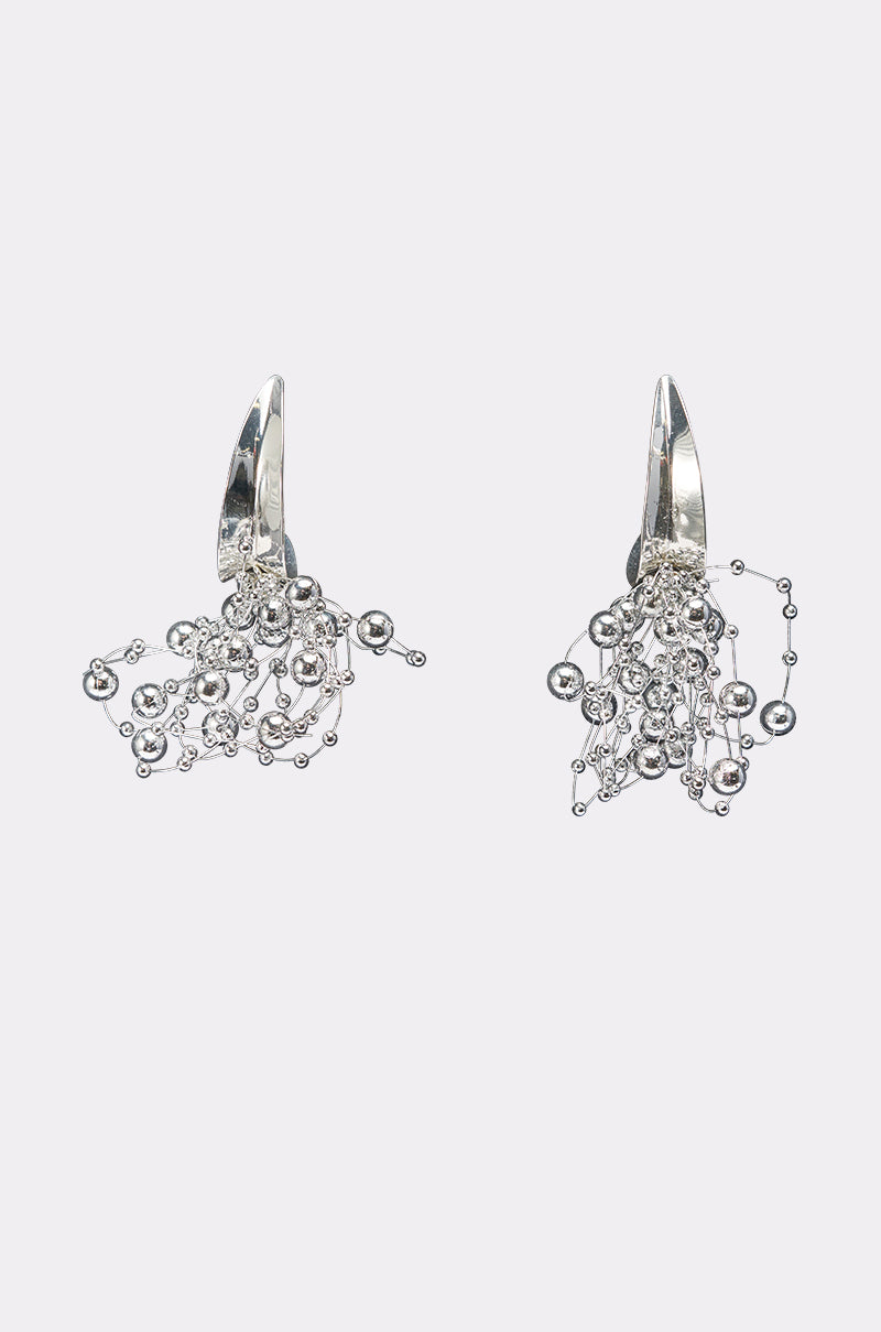 The BUBBLY EARRING features a cluster of small silver beads linked by thin wires in a delicate, cascading design—ideal for maximalist glam enthusiasts.