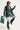 A stylish individual in the FEEL THE VIBE BUTTON DOWN FAUX LEATHER BLOUSE over a white top and denim shorts strikes a pose. They accessorize with black sunglasses, knee-high black leather boots, and a small green handbag while holding a large green tote bag.