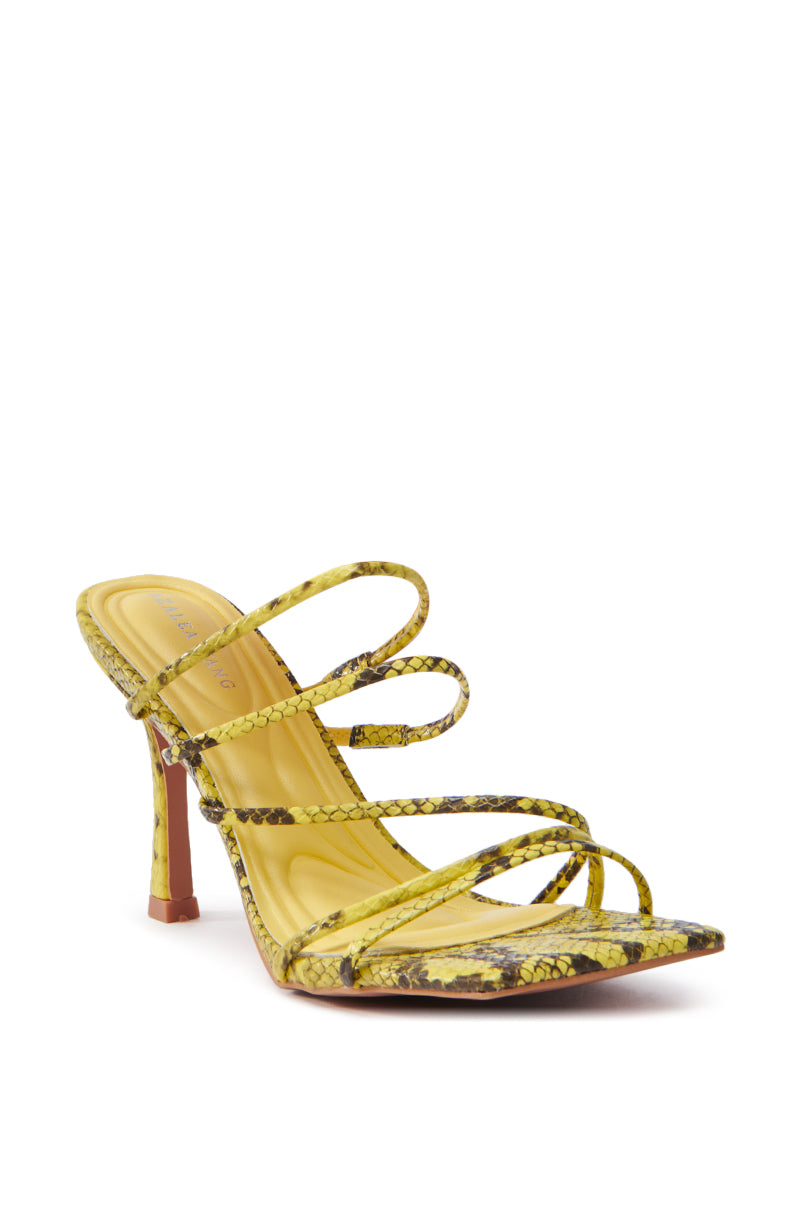 The AZALEA WANG HUGHIE YELLOW SNAKE SANDAL features an open square-toe design with a striking snakeskin pattern in yellow, crafted from vegan leather. Multiple thin straps crisscross the foot, and it's finished with a slender high heel for a chic look.