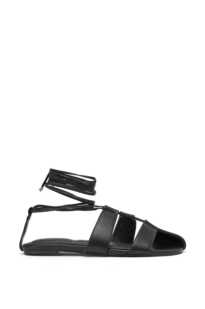 The AZALEA WANG ICHIRO BLACK PEEP TOE FLAT is a faux leather sandal featuring three wide straps, an open toe, and an ankle strap with back zipper—combining comfort and style for effortless wear. 3