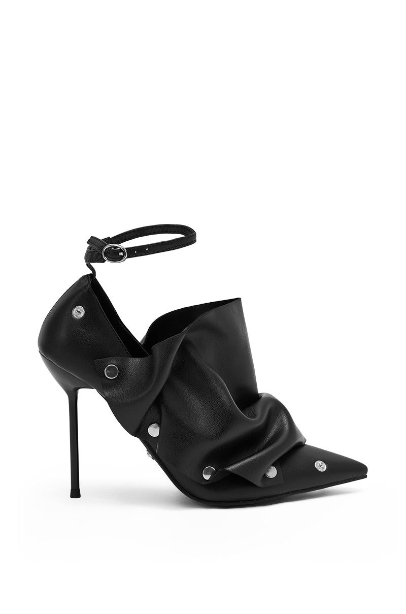The AZALEA WANG IMOGALE BLACK SILVER HARDWARE STILETTO PUMP is a high-heeled, pointed toe stiletto with an ankle strap and ruched faux leather draped details secured by silver studs.