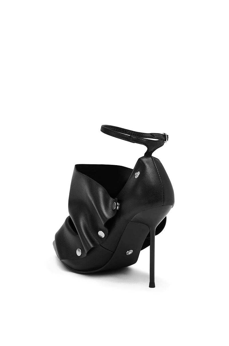 The AZALEA WANG IMOGALE Black Silver Hardware Stiletto Pump features a unique draped faux leather design, silver rivet accents, pointed toe, and an ankle strap with buckle, shown from the back and side.