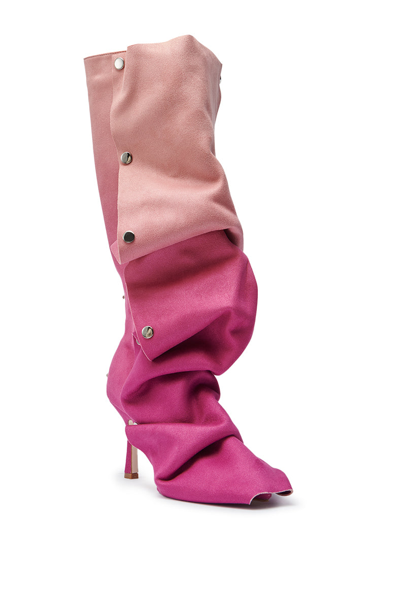 The AZALEA WANG IMOGINE Pink Multi Faux Suede Boot is a high-heeled, mid-calf slouchy boot with gradient pink shades, large metallic side snaps, and a pointed toe in luxe faux suede.