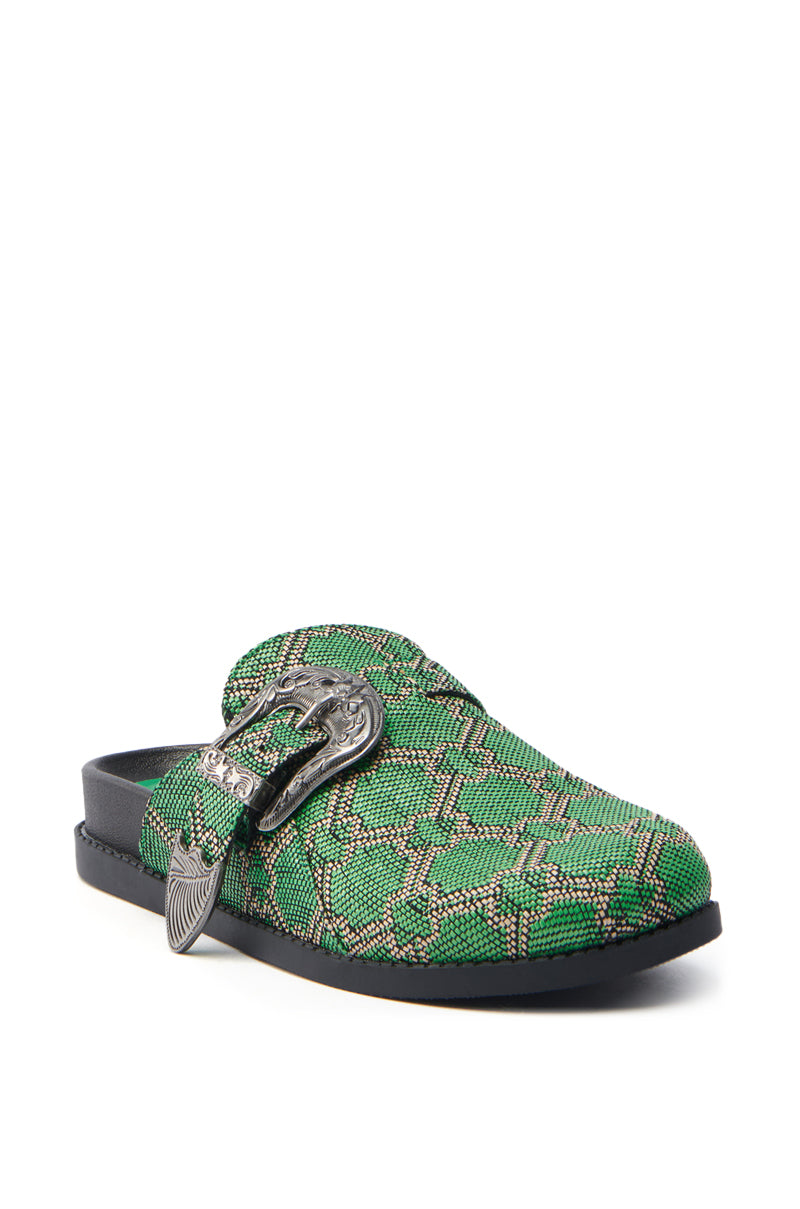 Meet the AZALEA WANG INFORMER GREEN SNAKE CLOG: a stylish slip-on with a chic snakeskin pattern and elegant silver buckle. It has a black sole and cushioned insole, blending style with comfort for an effortlessly fashionable appearance.