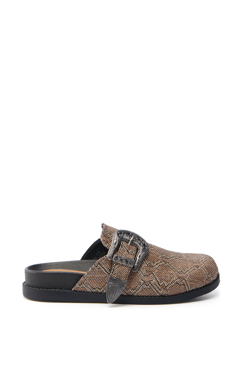 The AZALEA WANG INFORMER TAN SNAKE CLOG is a single brown textured slip-on with a snakeskin pattern, black sole, and decorative silver buckle. It features an open back and cushioned insole for casual comfort and stylish flair.