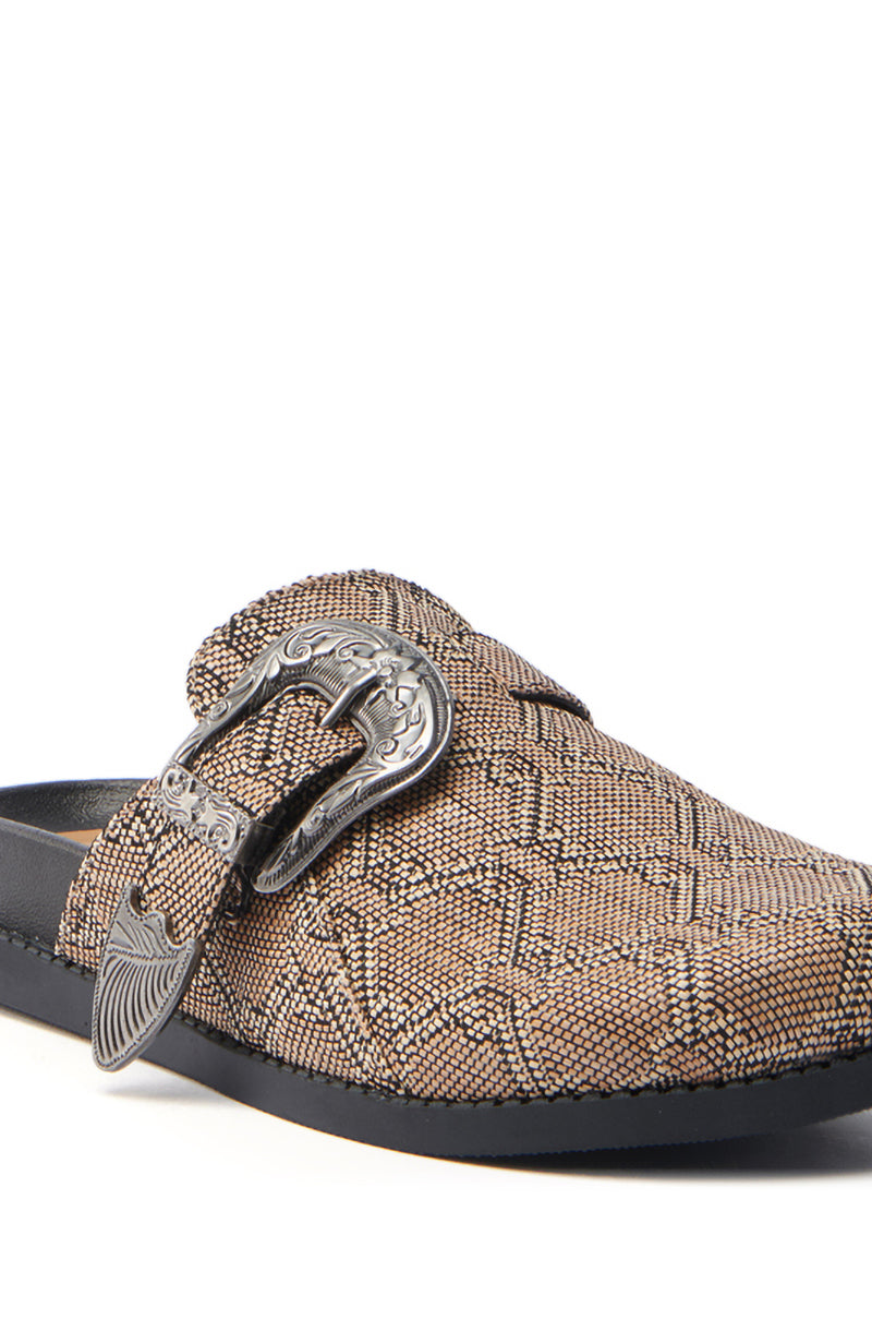 The AZALEA WANG Informer Tan Snake Clog is a textured brown slip-on with a decorative silver buckle and black sole. Its woven snakeskin-like pattern and intricately detailed buckle deliver an elegant yet edgy style.