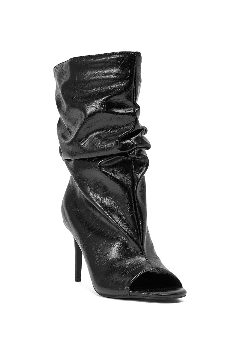 The AZALEA WANG IONE BLACK PU BOOTIE STILETTO features a slouchy silhouette, shiny textured black faux leather, a pointed open toe, and a high stiletto heel. 5