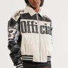 A woman with short hair wears the ON THE RUN MOTO BOMBER jacket, which is white and black with the word "Official" prominently displayed on the front. The jacket features the number 3 and star designs on the sleeves and is styled against a plain, white background.