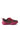 The AZALEA WANG ISABEAU FUCHSIA COLOR BLOCKED EMBELLISHED SNEAKER features a textured bright pink cleated sole, pink laces, and a black upper with multicolored rhinestone patterns.