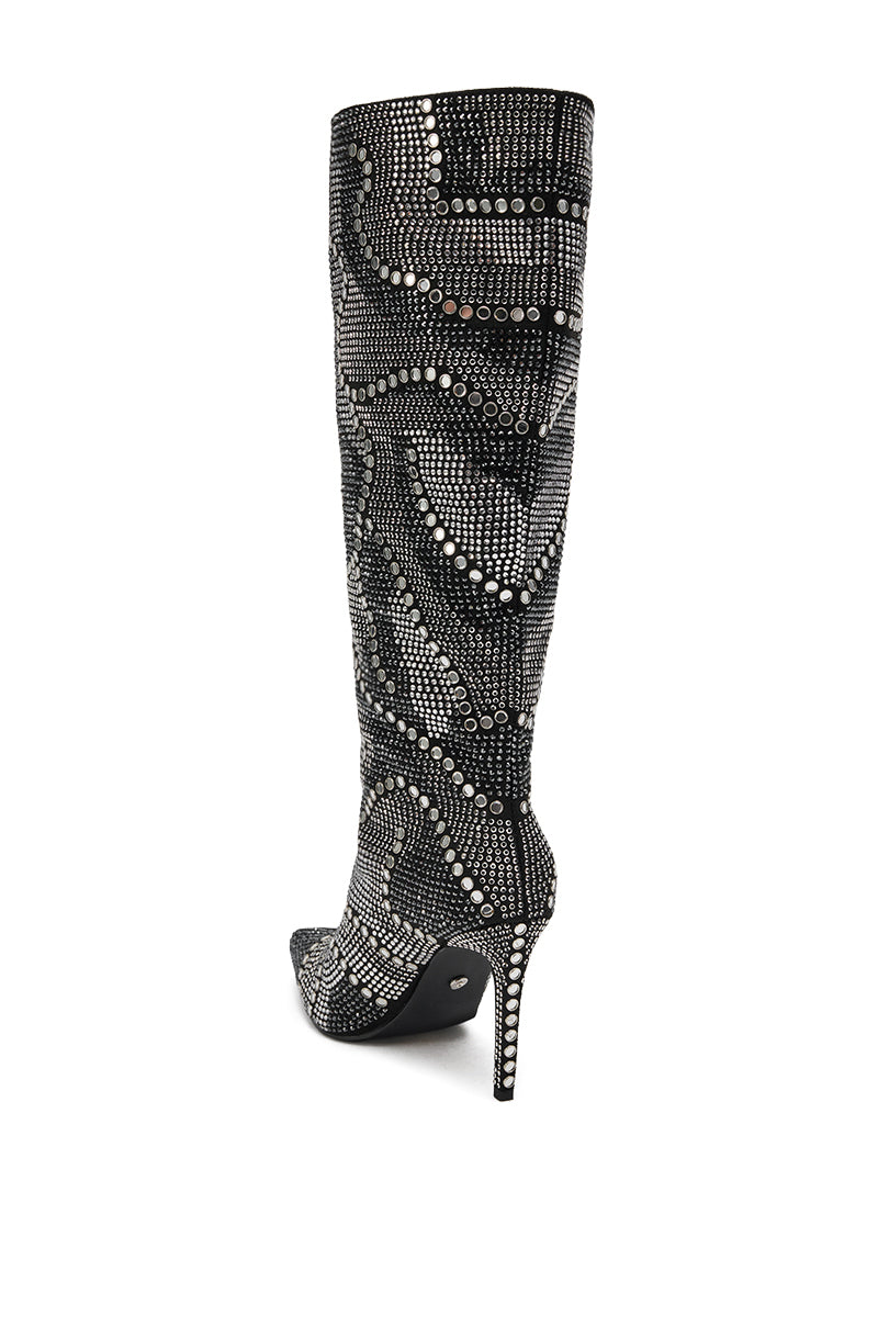 The AZALEA WANG ISILDA BLACK MULTI SEQUIN STILETTO BOOT is a chic knee-high covered in black fabric, embellished with silver and clear rhinestone patterns for a dazzling effect, viewed from the back and side.
