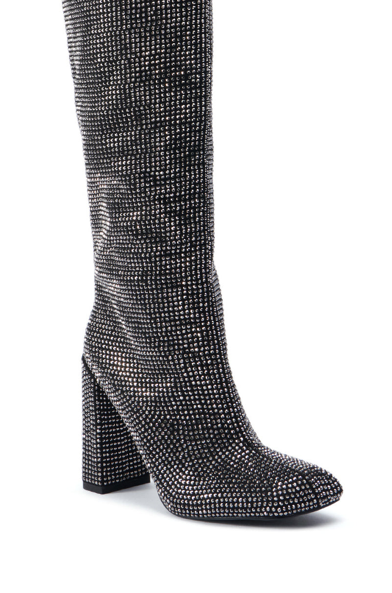 A close-up of the AZALEA WANG ISKANDER BLACK RHINESTONE BOOT adorned with sparkling silver rhinestones. This knee-high boot features a chunky high heel and pointed toe, showcasing a glamorous and eye-catching design. 5