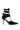 The AZALEA WANG ITHYKA Black Patent Stiletto Pump features a pointed toe, multiple ankle straps with silver buckles, and a glossy faux leather finish, shown on a white background.