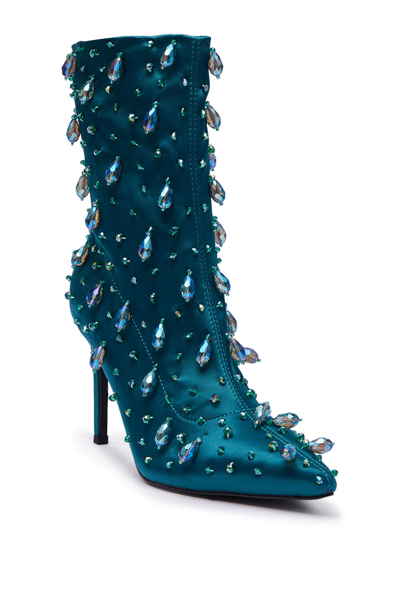 The AZALEA WANG IZIDOR TEAL EMBELLISHED RHINESTONE BOOTIE features a pointed toe, sparkling teardrop and round crystals, a sleek stiletto heel, and a side zipper for easy wear.