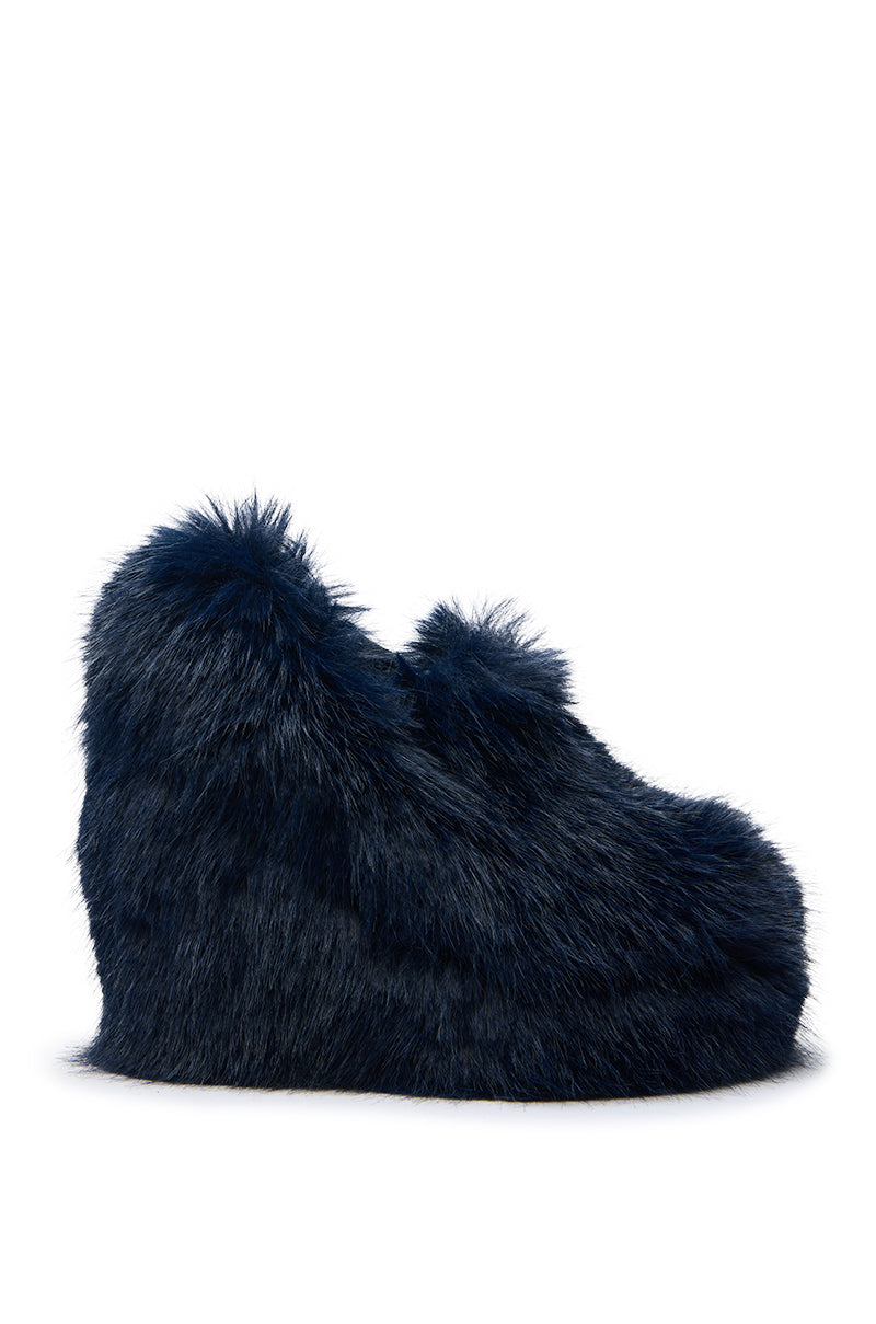 A side view of the AZALEA WANG JAEKE NAVY FUR WEDGE PUMP, featuring dark blue faux fur, a platform sole, and a fluffy textured surface, photographed against a white background.
