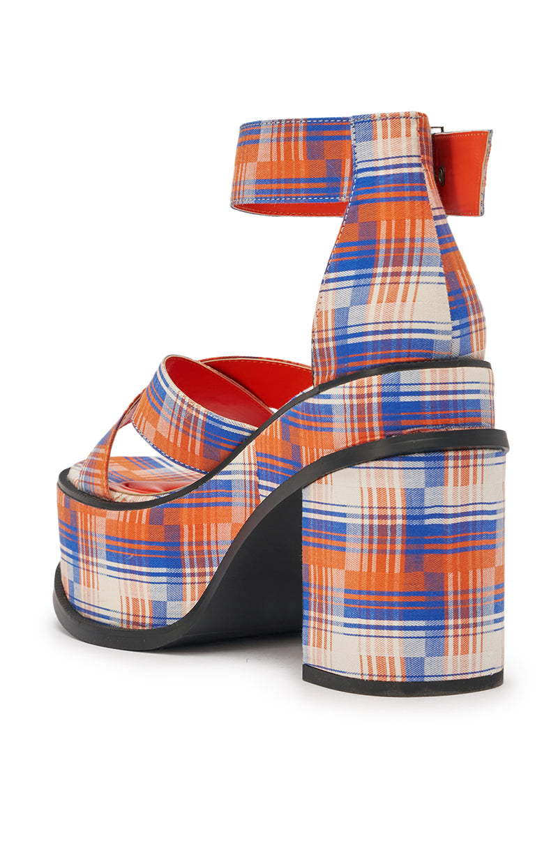 The AZALEA WANG JAETYN ORANGE PLAID CHUNKY PUMP is a retro-inspired block heel sandal featuring a bold orange and blue plaid pattern, ankle strap, and chunky black sole for eye-catching style and added height. 6
