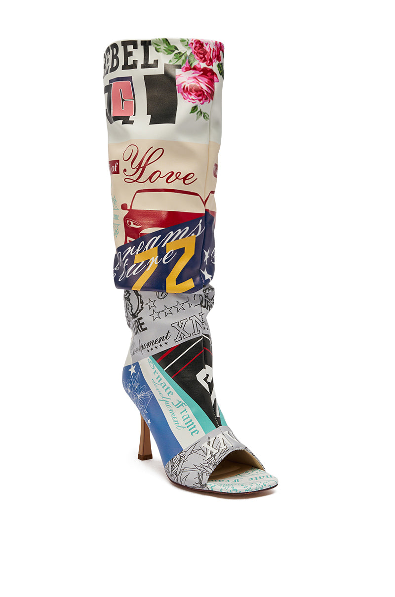 The AZALEA WANG JALISA MULTI NOVELTY PRINTED OPEN TOE BOOT is a knee-high style featuring a vibrant patchwork of flowers, text, stars, cars, and graphic designs on a light background.