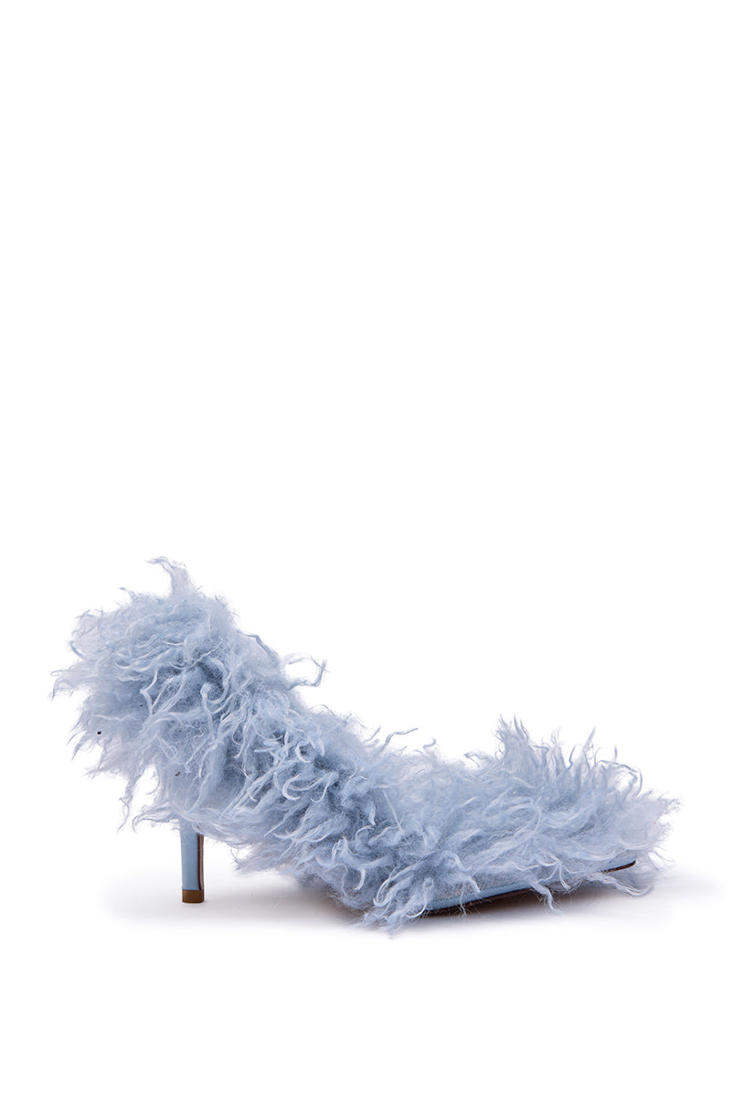 The AZALEA WANG JAMEEKA Baby Blue Curly Fur Pump Stiletto Heel features fluffy, shaggy faux fur for a bold, whimsical style. Pictured as a single shoe on a plain white background.
