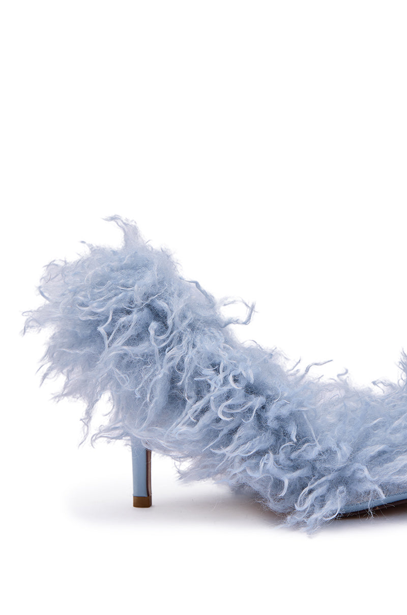 The AZALEA WANG JAMEEKA Baby Blue Curly Fur Pump Stiletto Heel features a light blue, fluffy curly faux fur upper, a pointed toe, and slender stiletto heel, showcased against a white background.