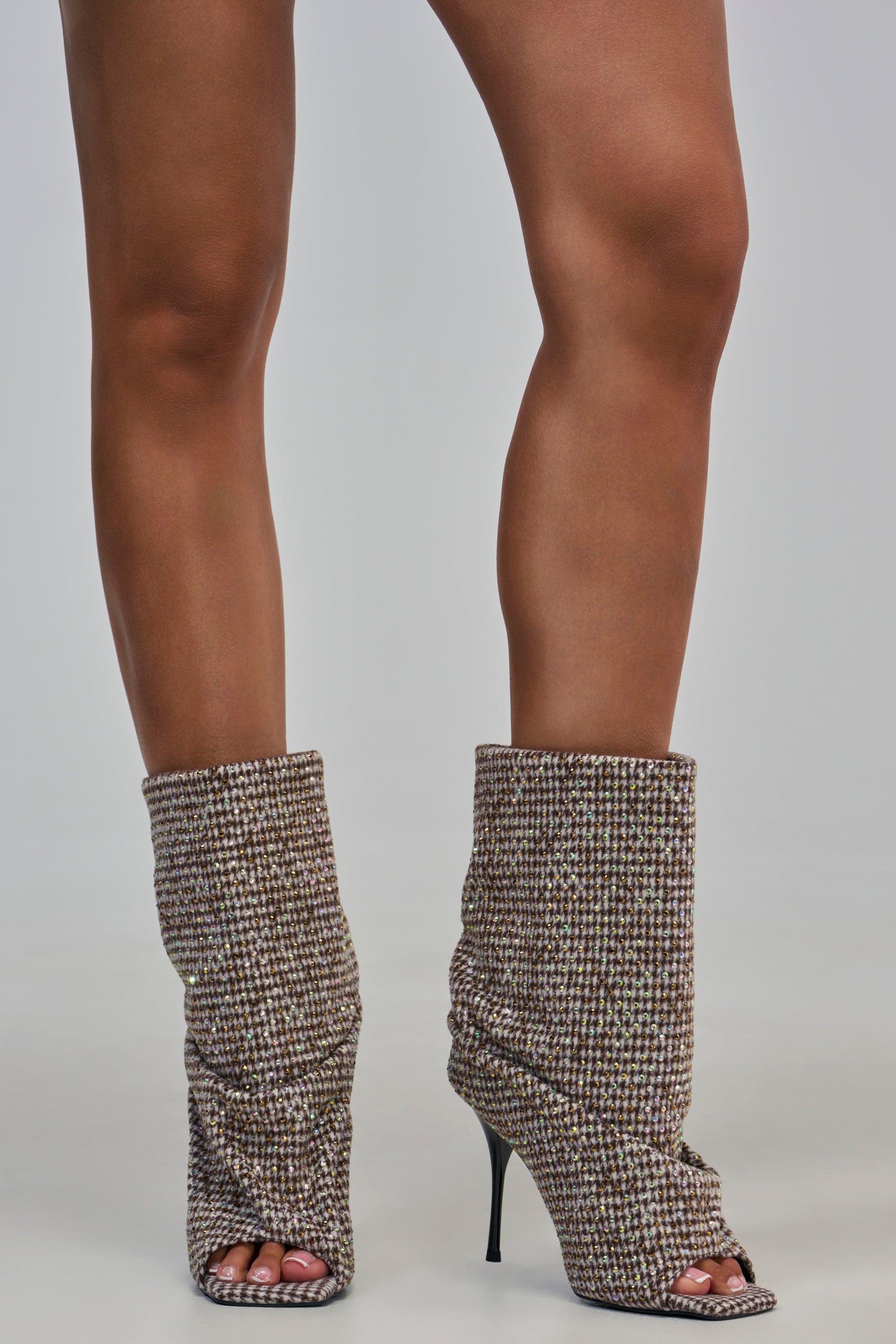AKIRA GOLD JANINE BLACK AND WHITE RHINESTONE PATTERN STILETTO OPEN TOE BOOTIE in a black and white houndstooth pattern with rhinestones and a thin stiletto heel.