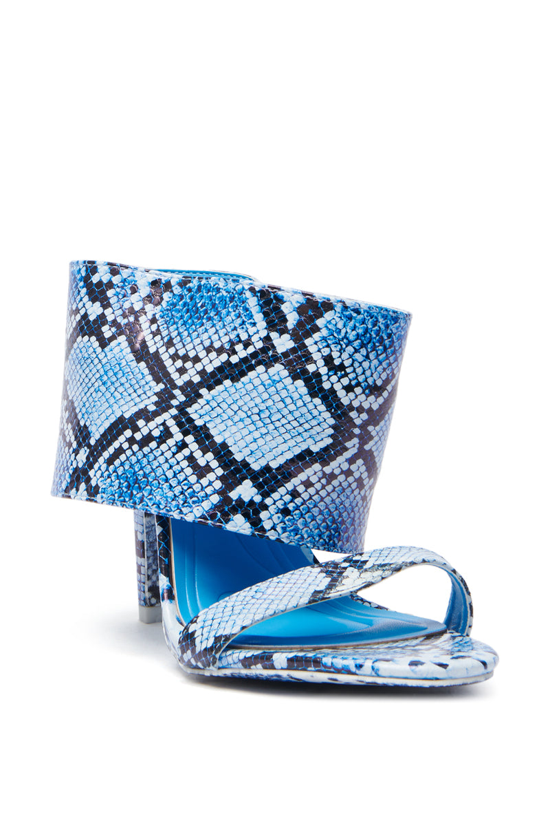 The AZALEA WANG JANSEN BLUE SNAKE STILETTO SANDAL is a single vegan leather high heel featuring a blue snakeskin pattern, wide ankle cuff, and two thin toe straps. Its sleek, modern design includes a stiletto heel for an elegant touch.
