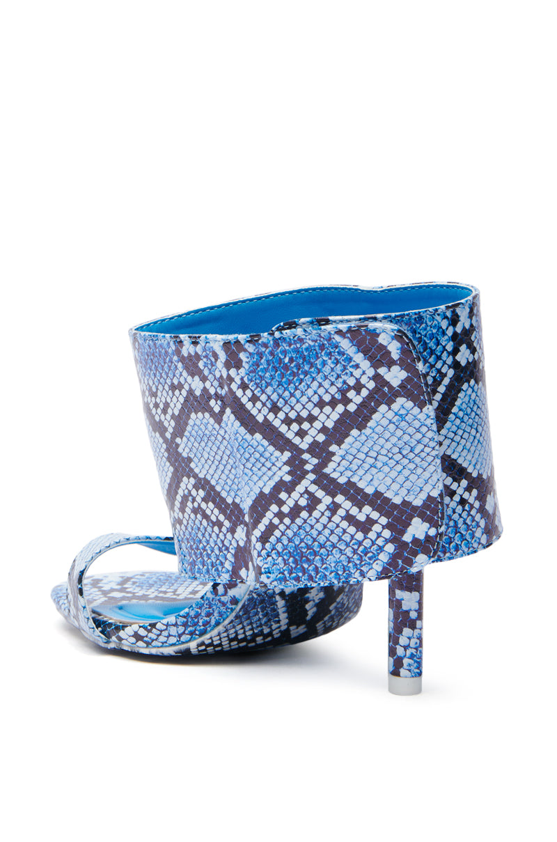 The AZALEA WANG JANSEN BLUE SNAKE STILETTO SANDAL is a vegan leather high heel featuring a blue and black snakeskin pattern, open toe, and sleek stiletto heel, for a modern, stylish look with unique textured colors that make a statement.