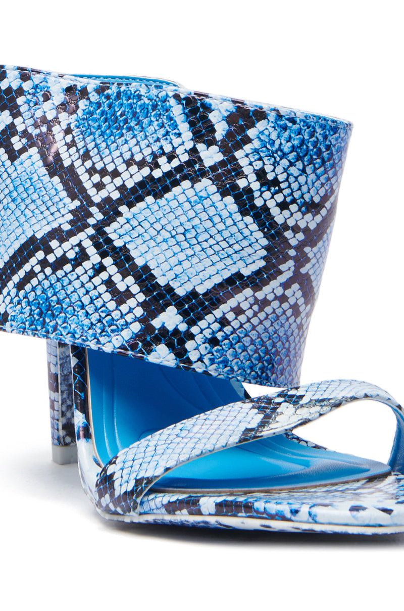 The AZALEA WANG JANSEN BLUE SNAKE STILETTO SANDAL has a vegan leather design with a blue and black snakeskin pattern, featuring a wide strap over the instep, open toe, matching stiletto heel, and a solid bright blue inner sole.