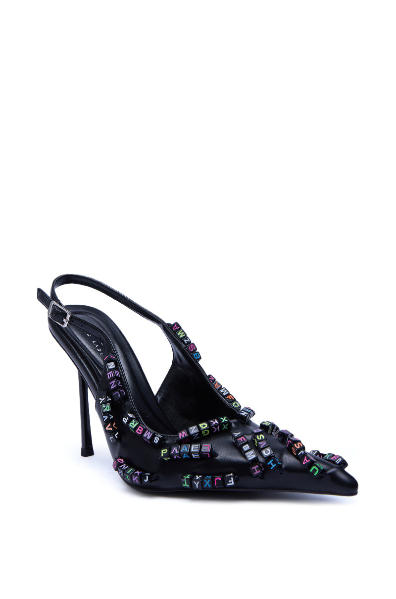 The AKIRA LETTER BEAD EMBELLISHED SLING BACK NOVELTY PUMP is a black, pointed toe stiletto heel, decorated with colorful block letter beads that create playful words and patterns on the straps.