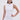 A woman in the IDK FELT CUTE RIBBED KNIT MINI DRESS, a sleeveless fitted mini with a rolled collar, stands confidently against a plain background. She wears her long dark hair in a top knot and accessorizes with large hoop earrings.