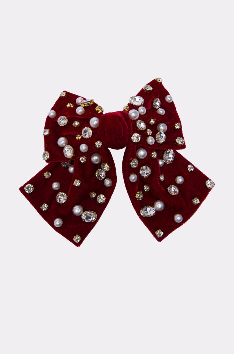 The JENNI EMBELLISHED HAIR BOW features deep red faux velvet adorned with clusters of pearls and sparkling rhinestones, shown on a plain white background. 1